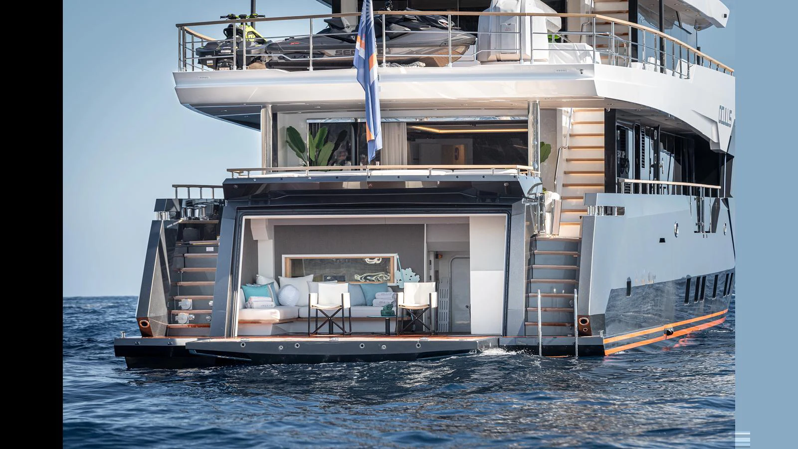 The yacht's aft deck features an inviting lounging area with plush seating and elegant decor, perfect for relaxation and socializing. aboard NUMARINE 37XP-21 Yacht for Sale