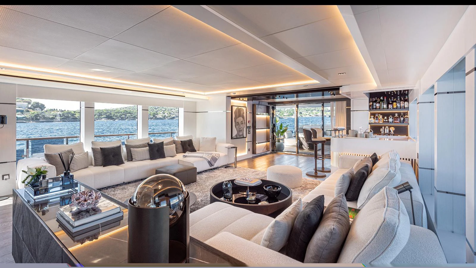 The spacious salon features elegant seating, modern decor, and panoramic windows offering stunning views. aboard NUMARINE 37XP-21 Yacht for Sale