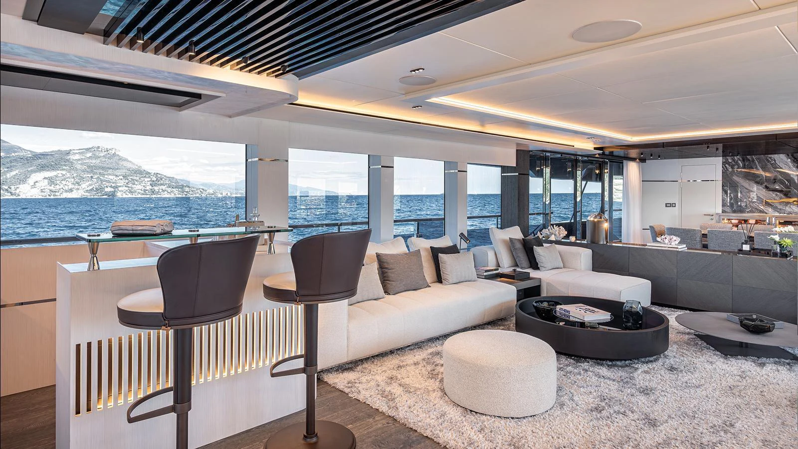 The yacht's salon features a spacious and modern design with panoramic ocean views. aboard NUMARINE 37XP-21 Yacht for Sale