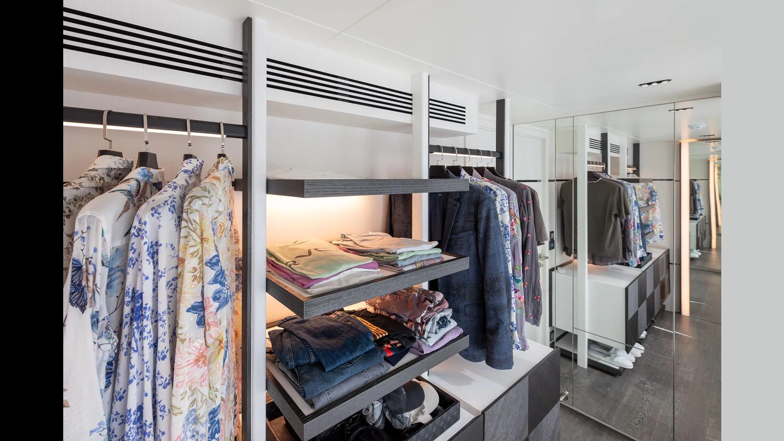 The yacht features a spacious and well-organized wardrobe area with ample storage for clothing and accessories. aboard NUMARINE 37XP-21 Yacht for Sale