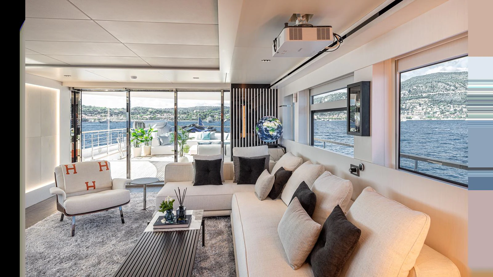 The salon offers a spacious and modern living area with panoramic views of the water. aboard NUMARINE 37XP-21 Yacht for Sale