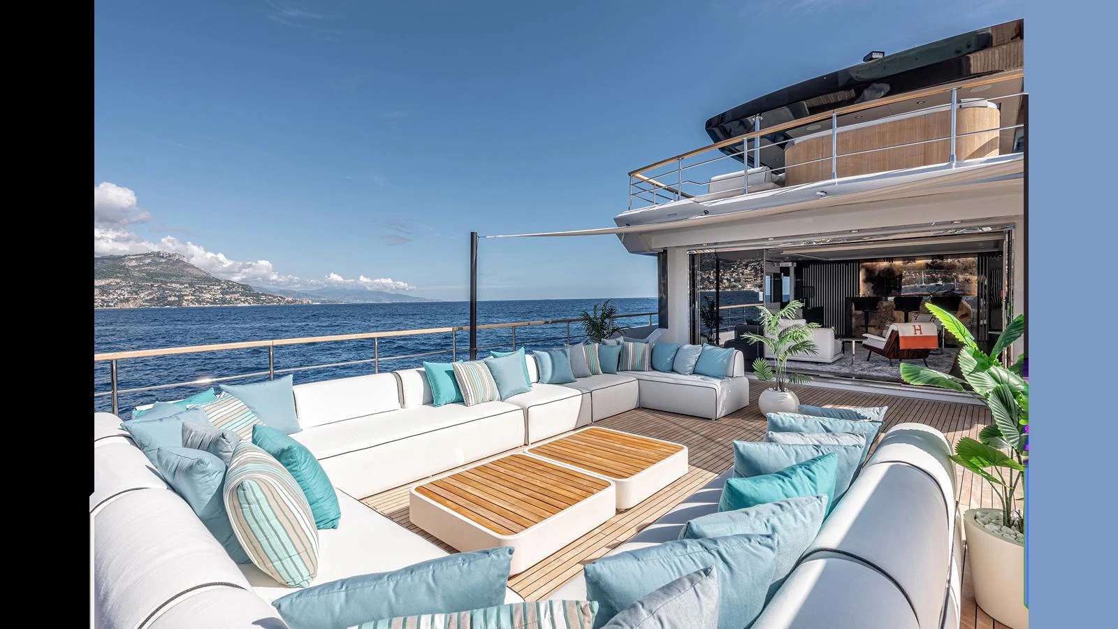 The aft deck features a spacious and luxurious seating area with stunning ocean views. aboard NUMARINE 37XP-21 Yacht for Sale