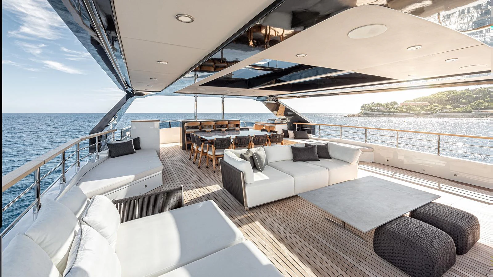 The spacious aft deck offers luxurious seating and dining areas with stunning ocean views. aboard NUMARINE 37XP-21 Yacht for Sale