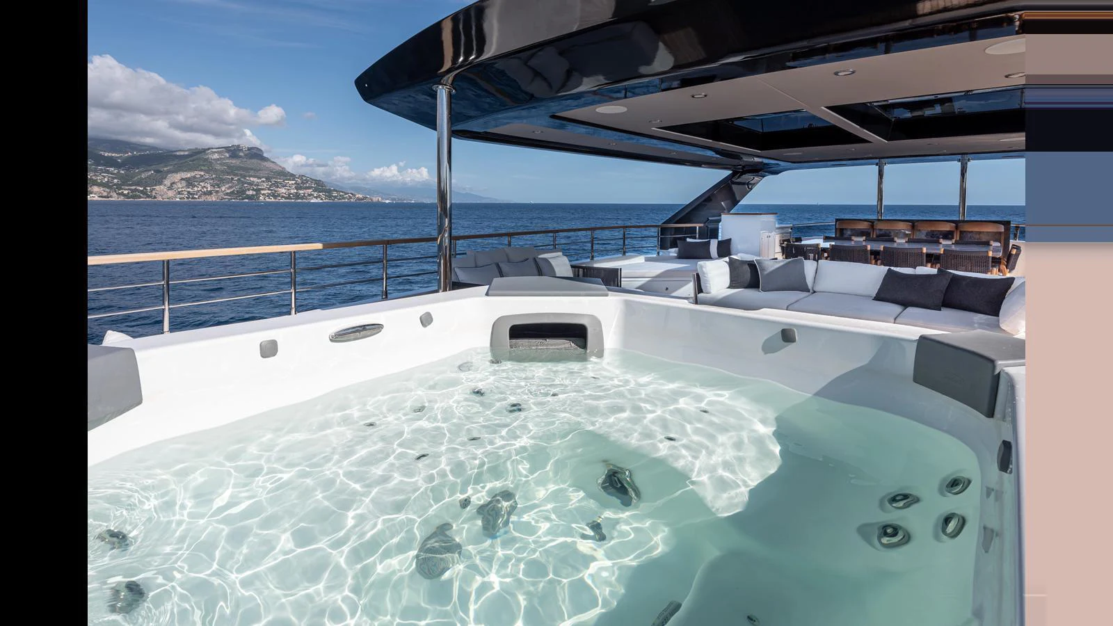 The sundeck features a luxurious hot tub with stunning ocean views. aboard NUMARINE 37XP-21 Yacht for Sale