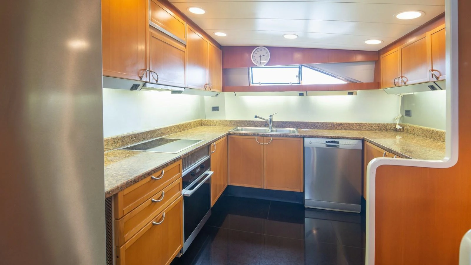 The yacht's galley features modern appliances and ample counter space, creating a functional and inviting cooking area. aboard BLUE RIBBON Yacht for Sale