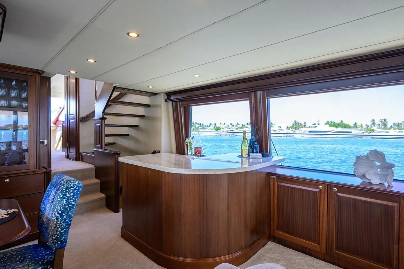 a room with a table and chairs aboard JULE Yacht for Sale