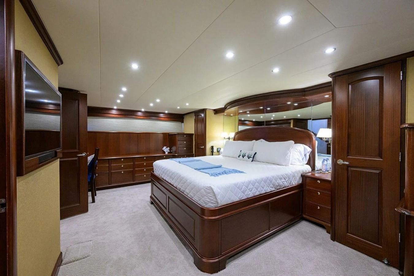 a large bedroom with a large bed aboard JULE Yacht for Sale