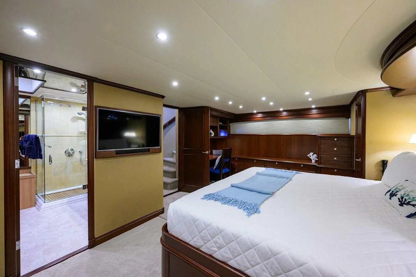 a bedroom with a bed and a television aboard JULE Yacht for Sale