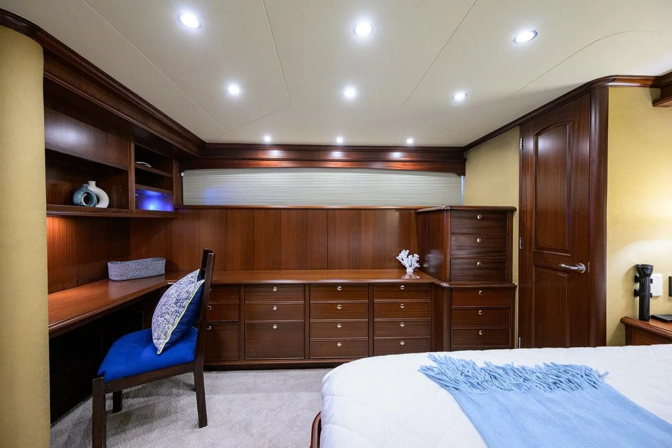 a bedroom with a bed and a desk aboard JULE Yacht for Sale