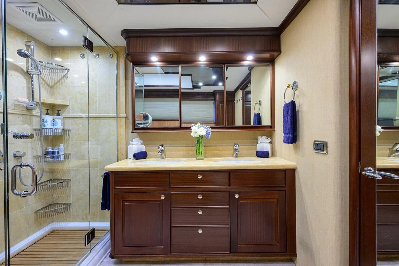 a bathroom with a glass shower aboard JULE Yacht for Sale