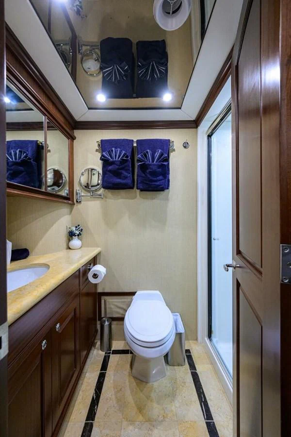 a bathroom with a toilet and a sink aboard JULE Yacht for Sale