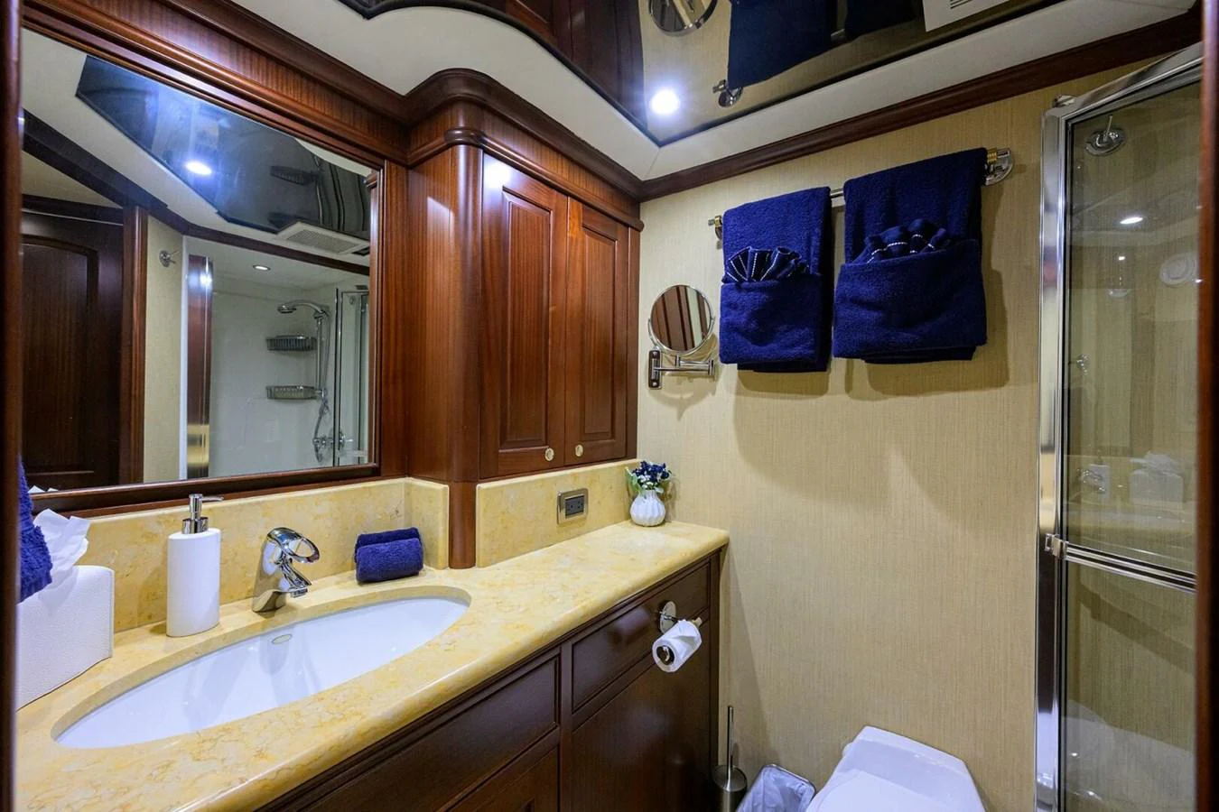 a bathroom with a sink and mirror aboard JULE Yacht for Sale