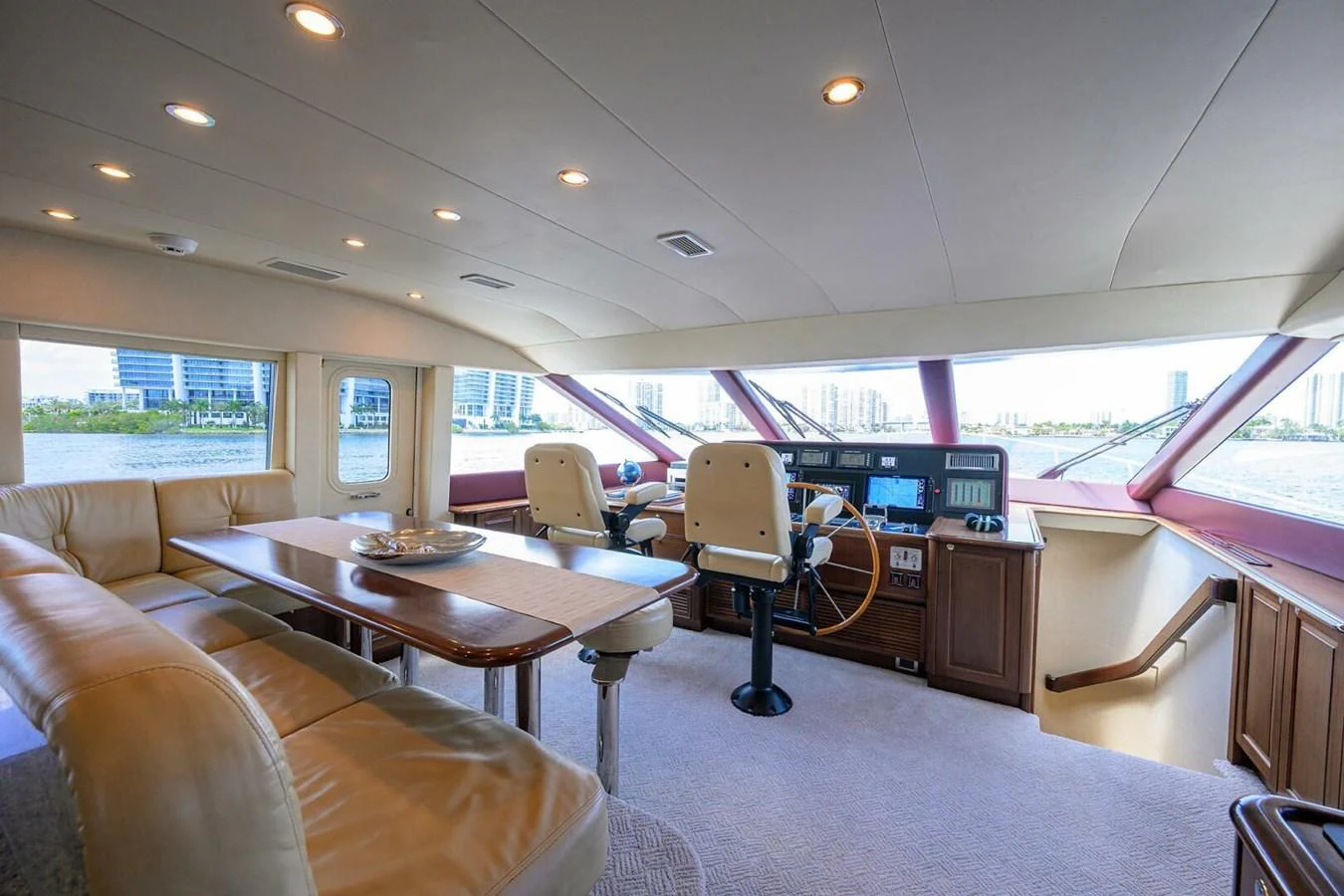 a room with a table and chairs aboard JULE Yacht for Sale
