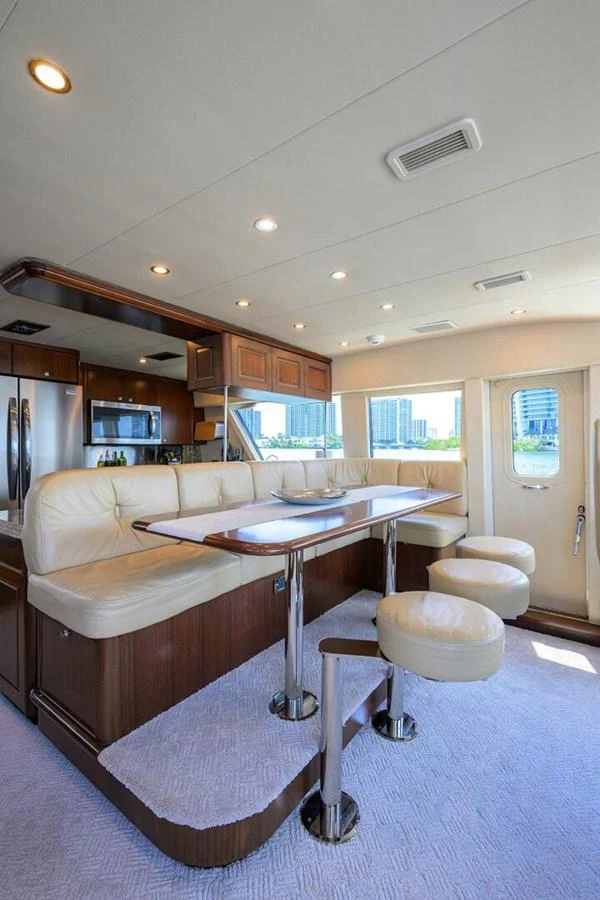 a living room with a couch and a table aboard JULE Yacht for Sale