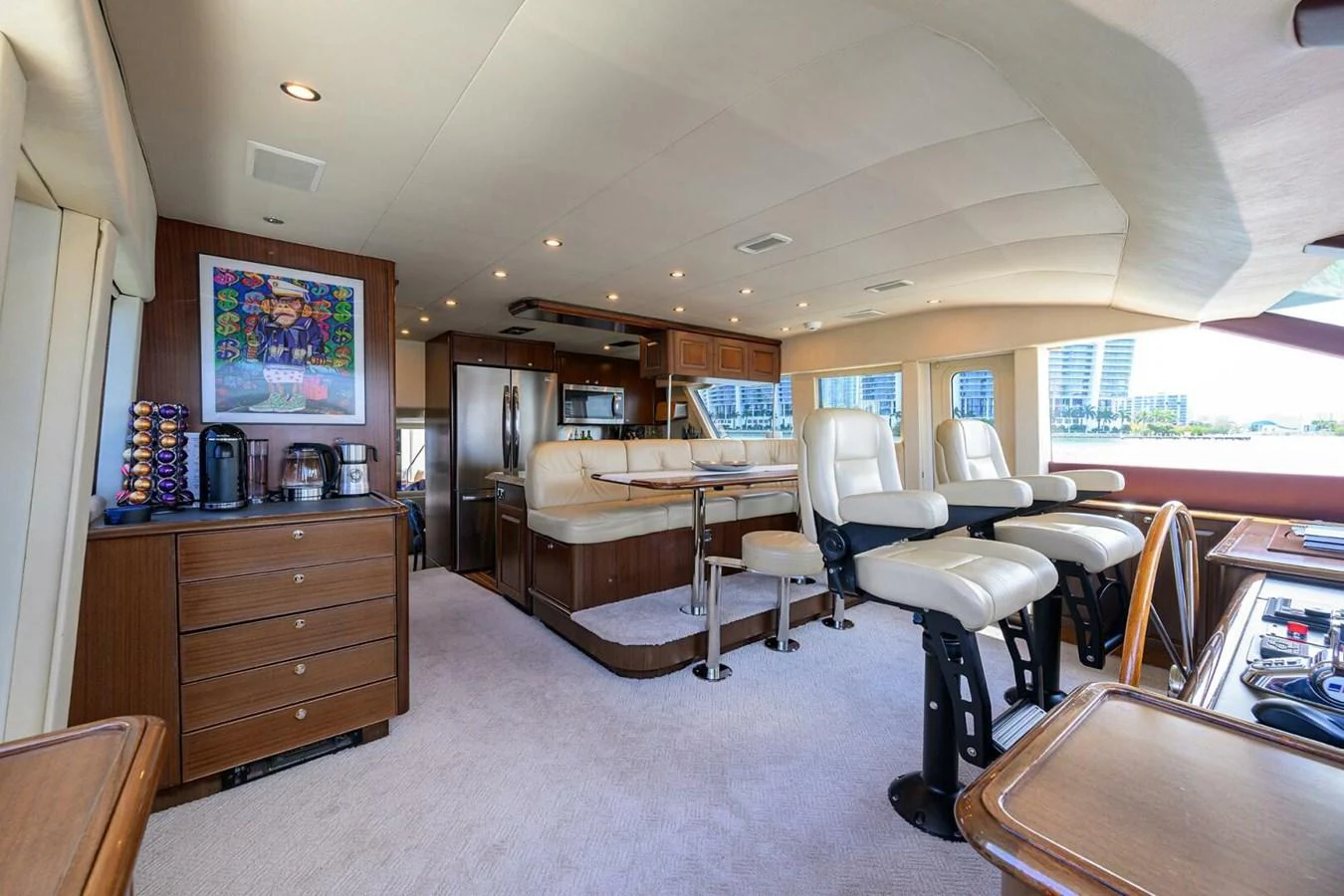 a room with tables and chairs aboard JULE Yacht for Sale