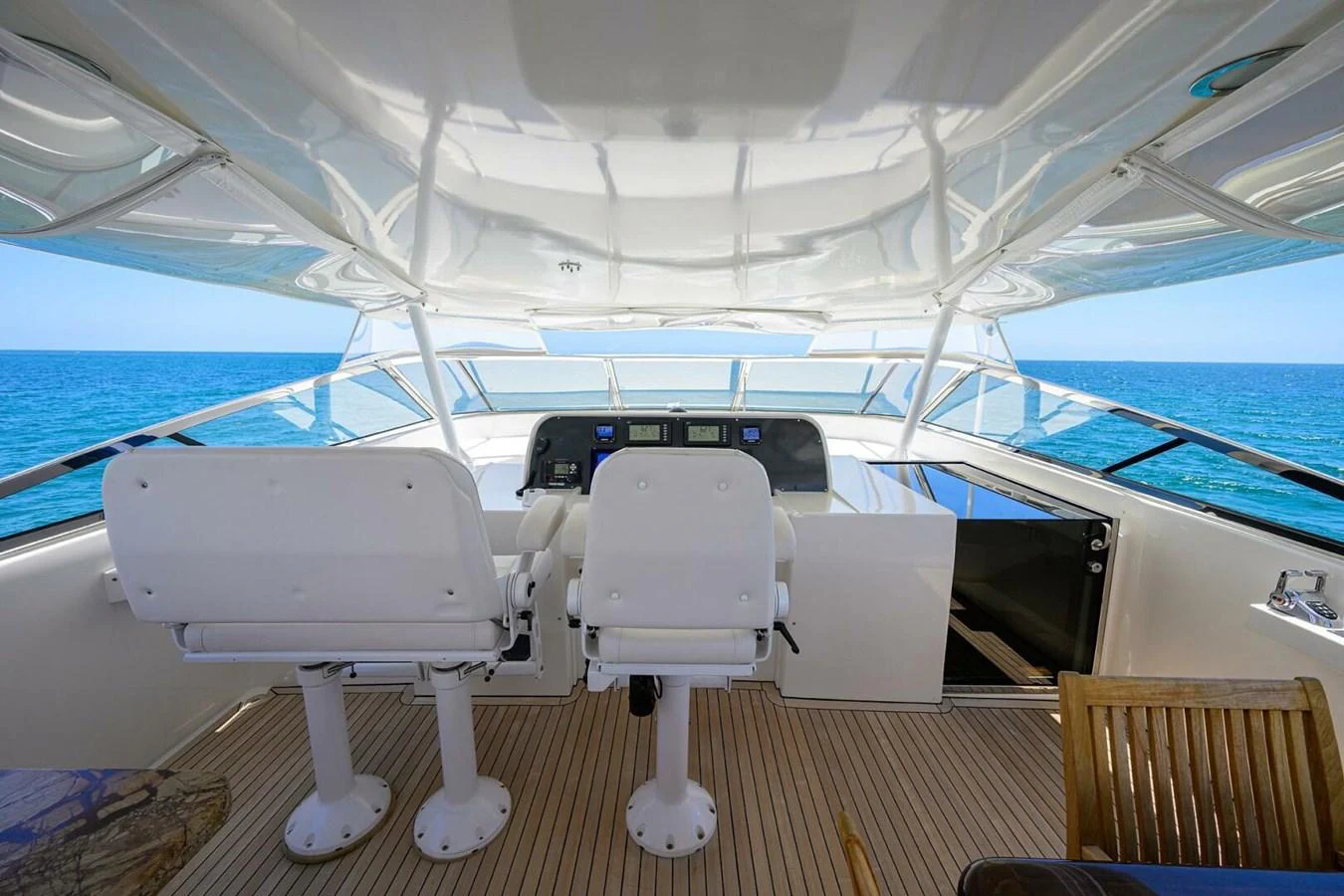 a boat with chairs on the deck aboard JULE Yacht for Sale