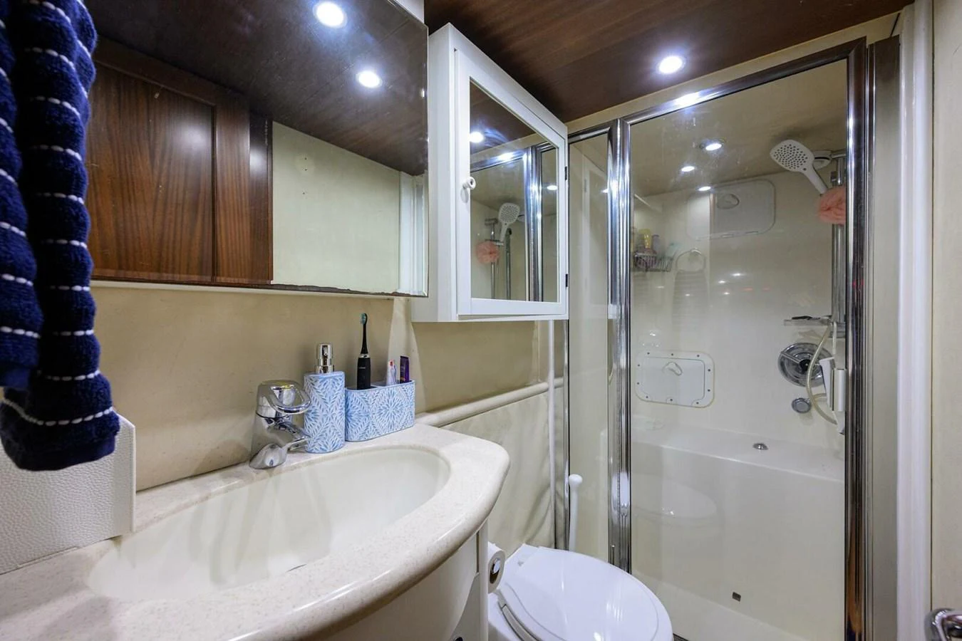 a bathroom with a glass shower aboard JULE Yacht for Sale