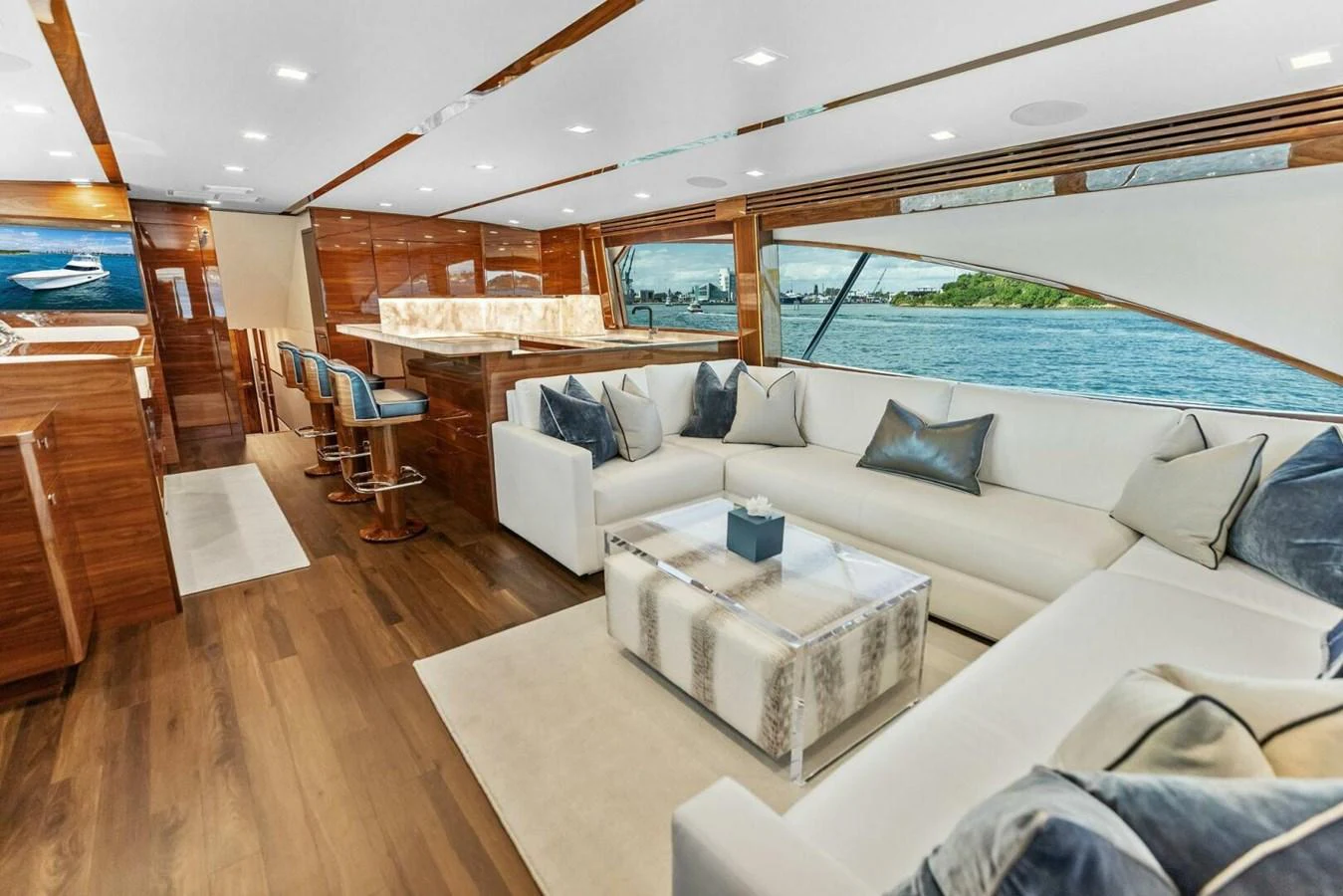 The salon features luxurious seating with panoramic views of the surrounding waters. aboard TEAM HARVEY I Yacht for Sale