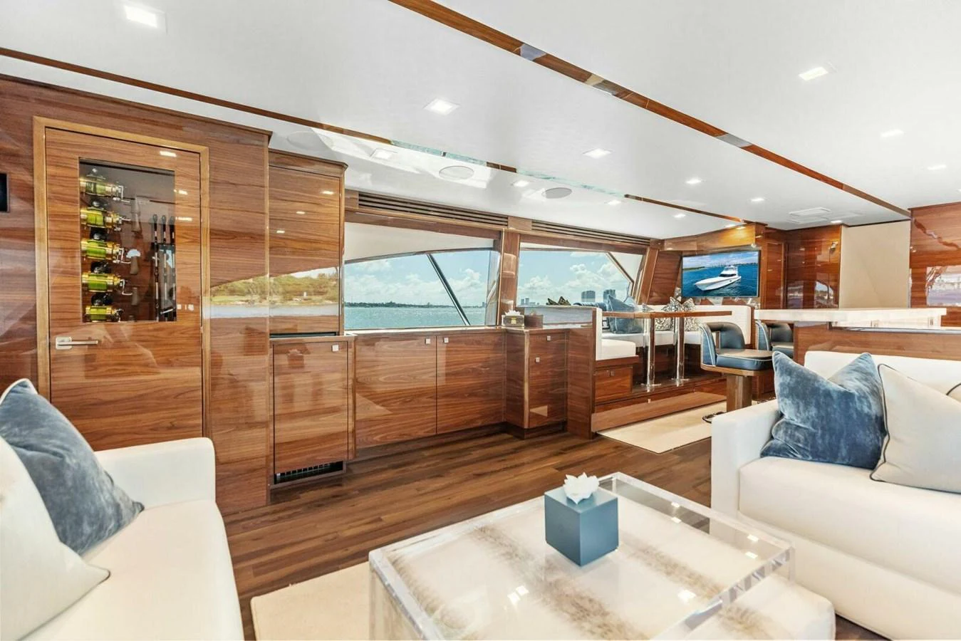 The salon features luxurious seating, elegant wood finishes, and large windows offering stunning views. aboard TEAM HARVEY I Yacht for Sale