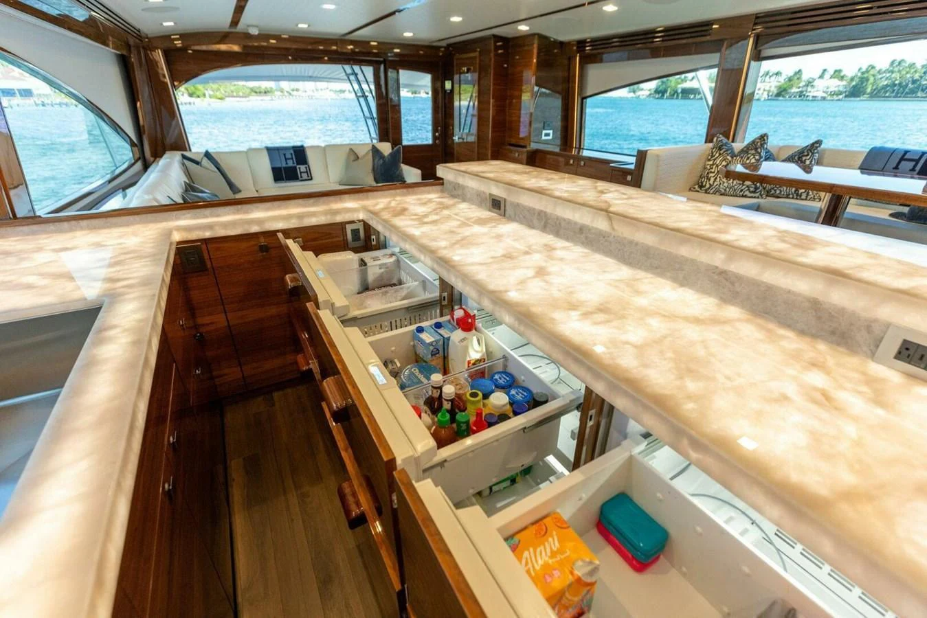 The galley features modern appliances and ample storage with a scenic view of the water. aboard TEAM HARVEY I Yacht for Sale