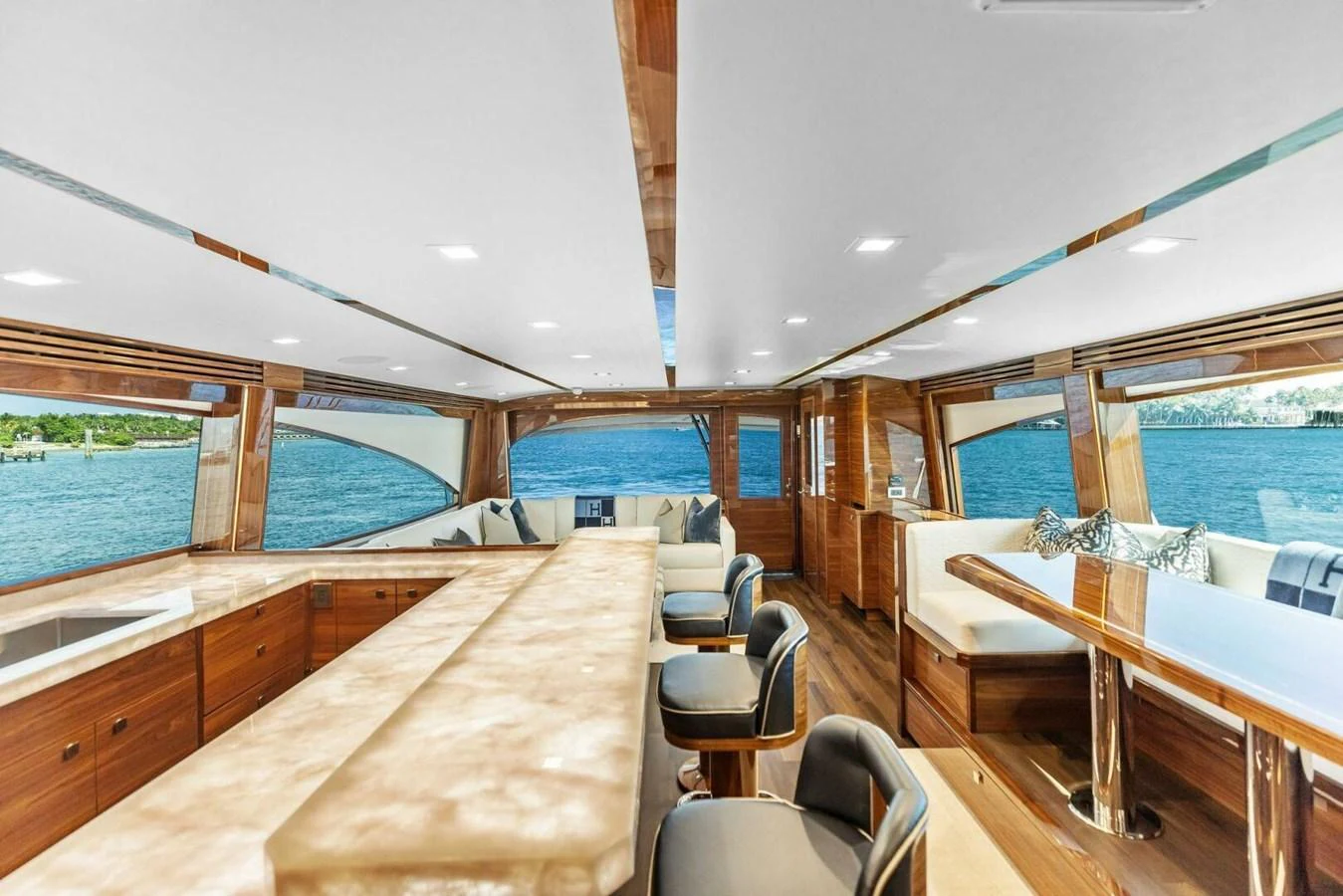 The salon offers a spacious and luxurious setting with panoramic views of the sea. aboard TEAM HARVEY I Yacht for Sale