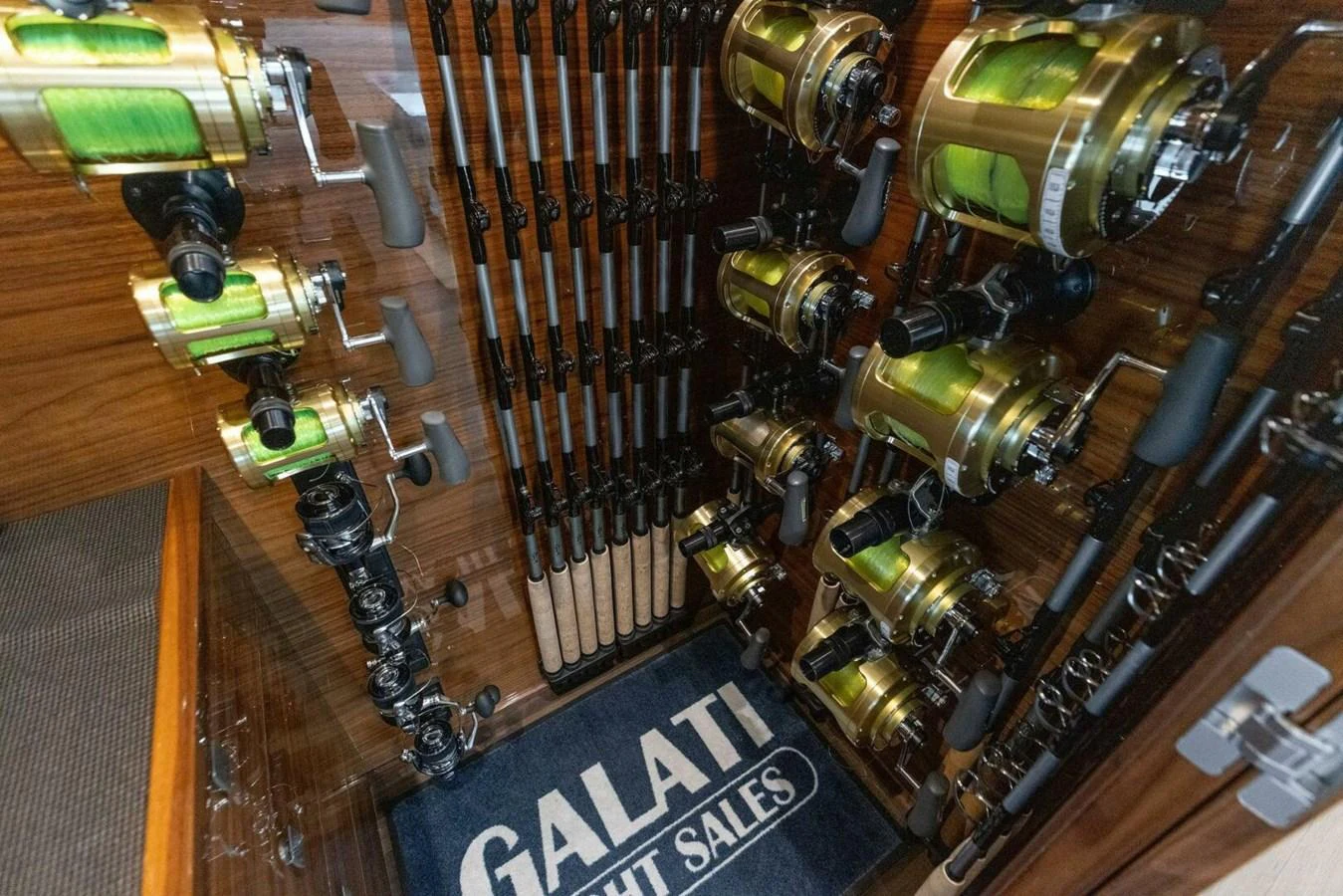 A well-organized storage area for fishing rods and reels on the yacht. aboard TEAM HARVEY I Yacht for Sale