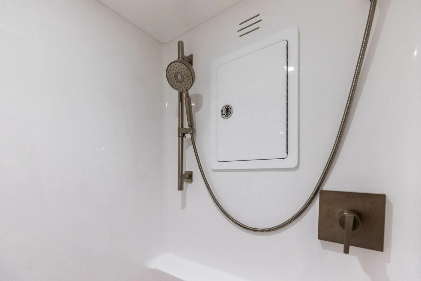 A sleek and modern shower fixture in a yacht's bathroom. aboard TEAM HARVEY I Yacht for Sale