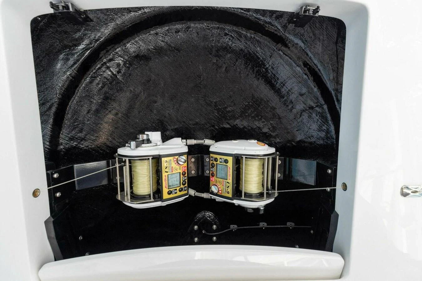 The image showcases a detailed view of the yacht's fishing reel setup, highlighting its advanced equipment. aboard TEAM HARVEY I Yacht for Sale