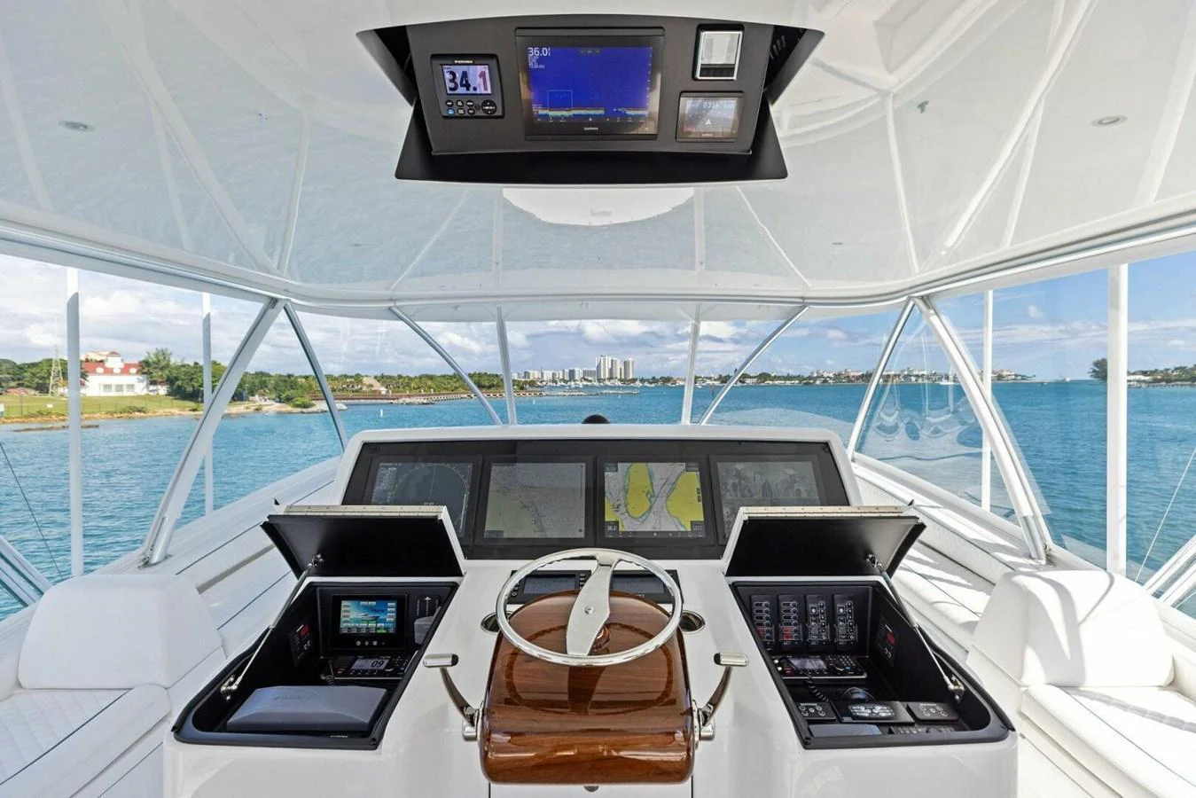 The helm station offers a commanding view with advanced navigation equipment and luxurious finishes. aboard TEAM HARVEY I Yacht for Sale