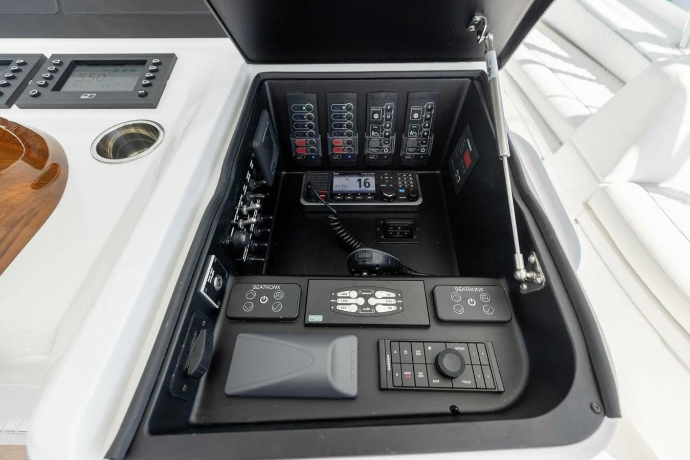 The image showcases the helm station with advanced navigation and control systems. aboard TEAM HARVEY I Yacht for Sale
