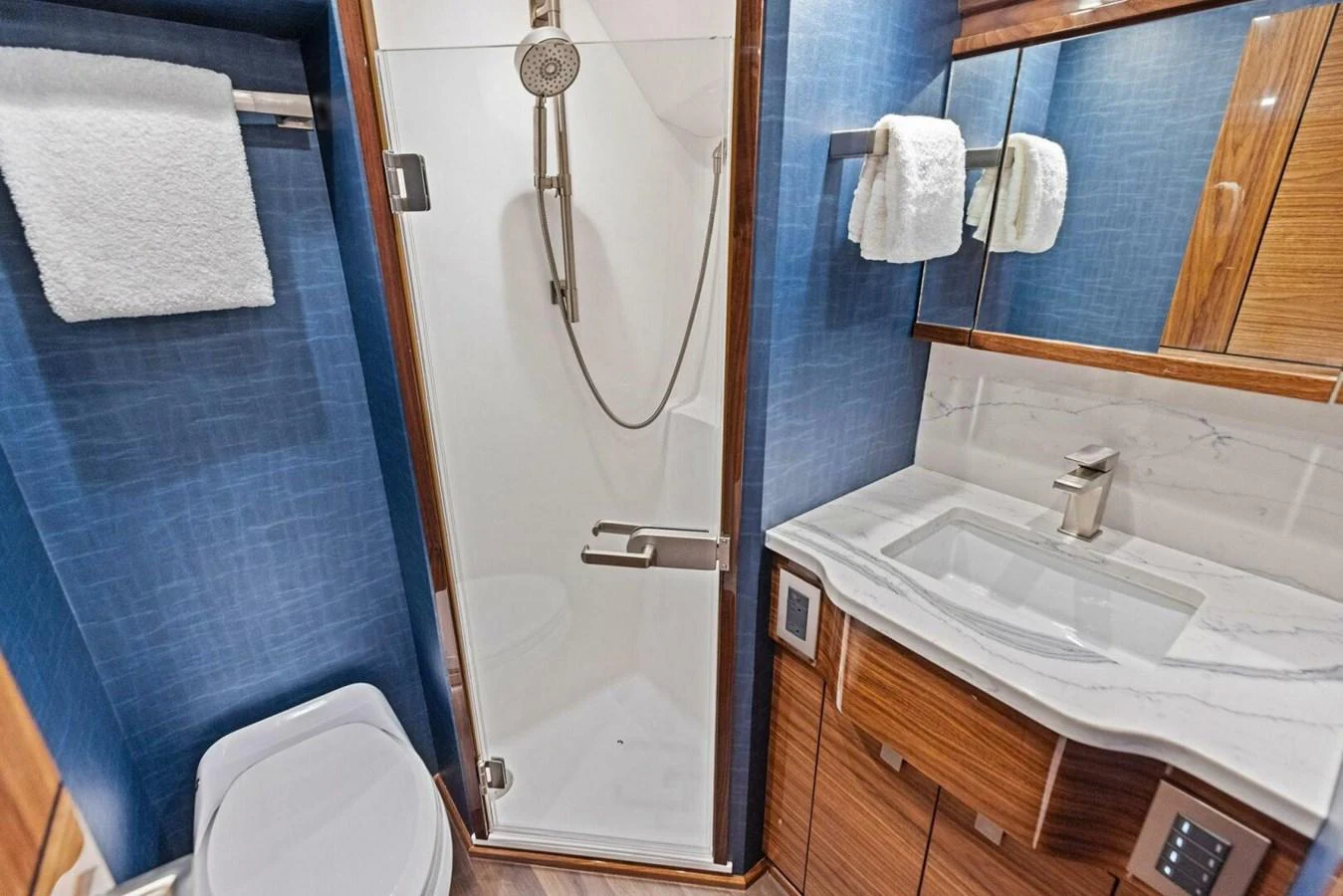 A well-appointed yacht bathroom featuring modern fixtures and elegant finishes. aboard TEAM HARVEY I Yacht for Sale