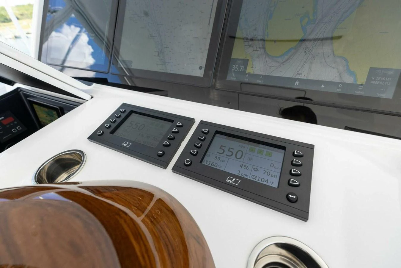 The helm features advanced navigation and control systems with sleek, modern displays. aboard TEAM HARVEY I Yacht for Sale