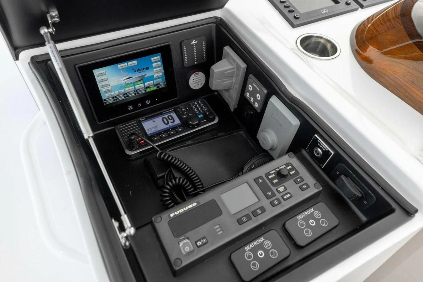 A close-up view of the yacht's helm electronics and navigation equipment. aboard TEAM HARVEY I Yacht for Sale