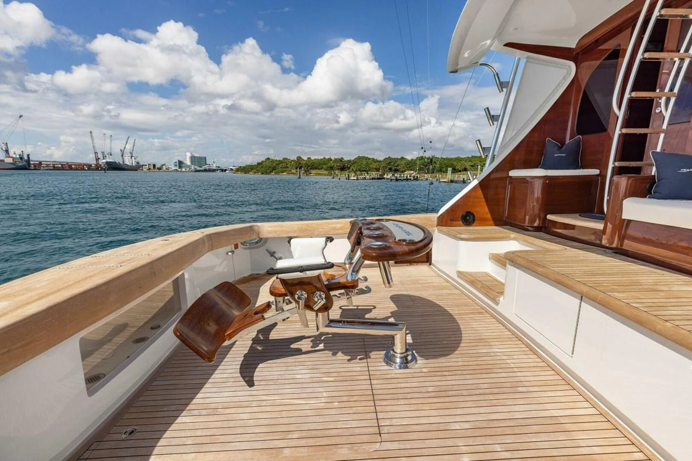 The aft deck features a comfortable seating area with a stunning view of the water. aboard TEAM HARVEY I Yacht for Sale
