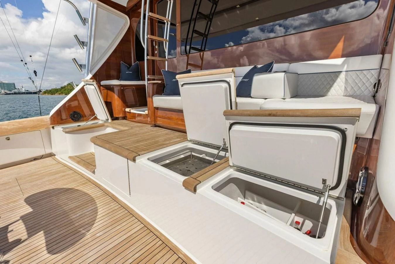 The aft deck features comfortable seating and convenient storage compartments, perfect for relaxation and functionality. aboard TEAM HARVEY I Yacht for Sale