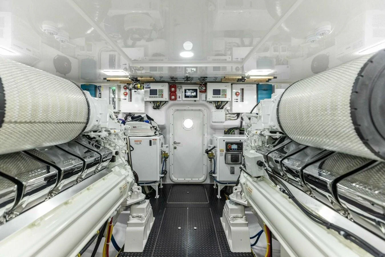 The image showcases the pristine and well-organized engine room of the yacht. aboard TEAM HARVEY I Yacht for Sale