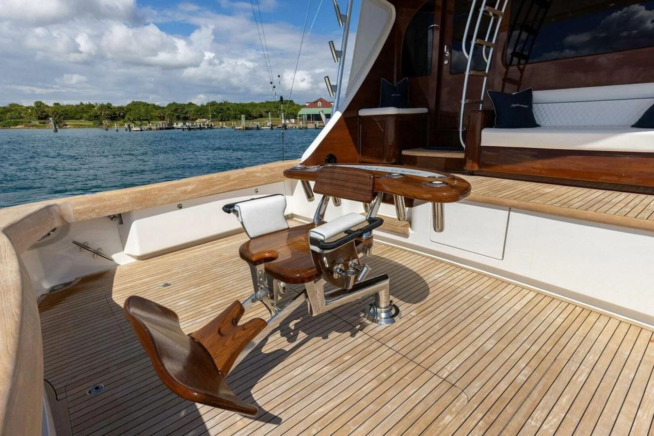 The aft deck features a well-equipped fishing station with comfortable seating and a scenic view of the water. aboard TEAM HARVEY I Yacht for Sale