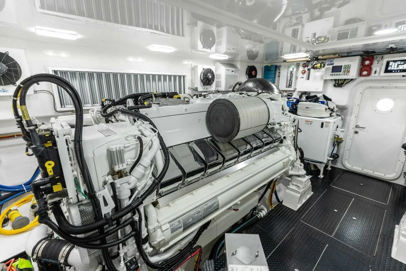 The image showcases a pristine and well-organized engine room with advanced machinery and equipment. aboard TEAM HARVEY I Yacht for Sale