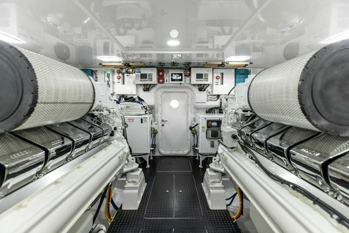 The image showcases a pristine and well-organized engine room with advanced machinery and equipment. aboard TEAM HARVEY I Yacht for Sale