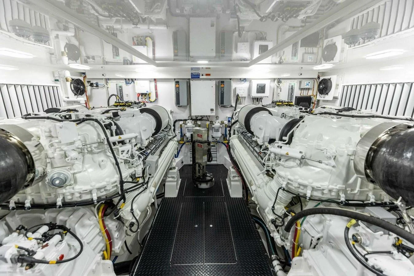 The engine room showcases powerful twin engines and a meticulously organized layout. aboard TEAM HARVEY I Yacht for Sale