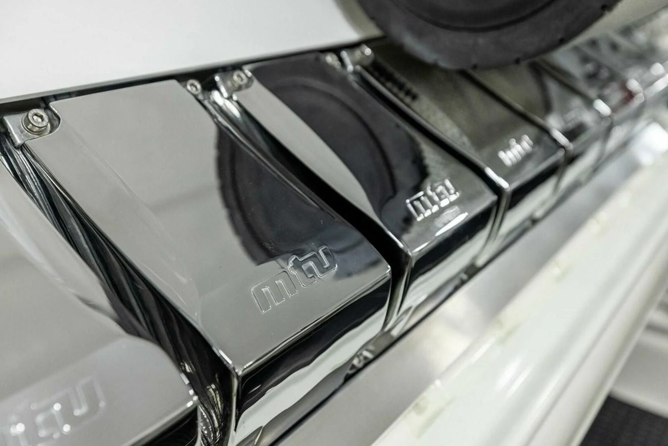 A close-up view of polished metallic engine components showcasing the yacht's engineering excellence. aboard TEAM HARVEY I Yacht for Sale
