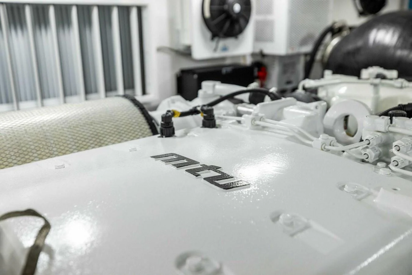 The image showcases the pristine engine room of the yacht, highlighting the MTU engine. aboard TEAM HARVEY I Yacht for Sale