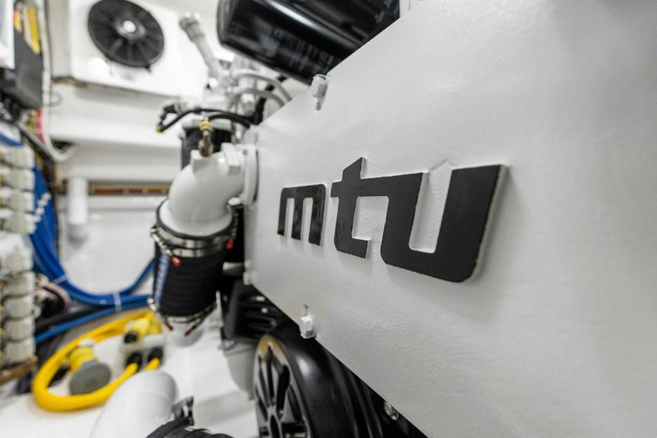 A close-up view of the yacht's engine room showcasing the MTU engine. aboard TEAM HARVEY I Yacht for Sale