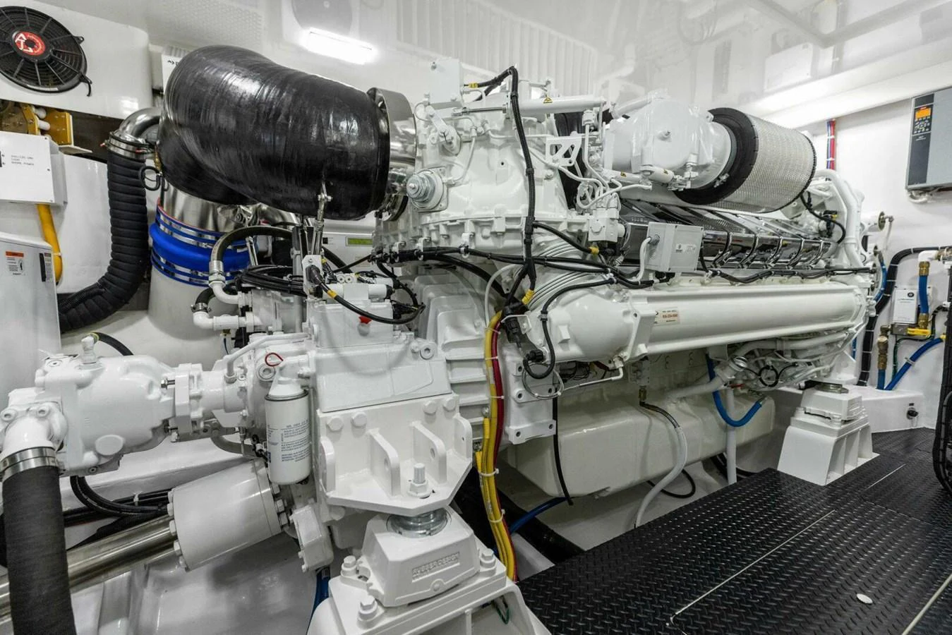 The image showcases the meticulously maintained engine room of the yacht, highlighting its powerful machinery. aboard TEAM HARVEY I Yacht for Sale