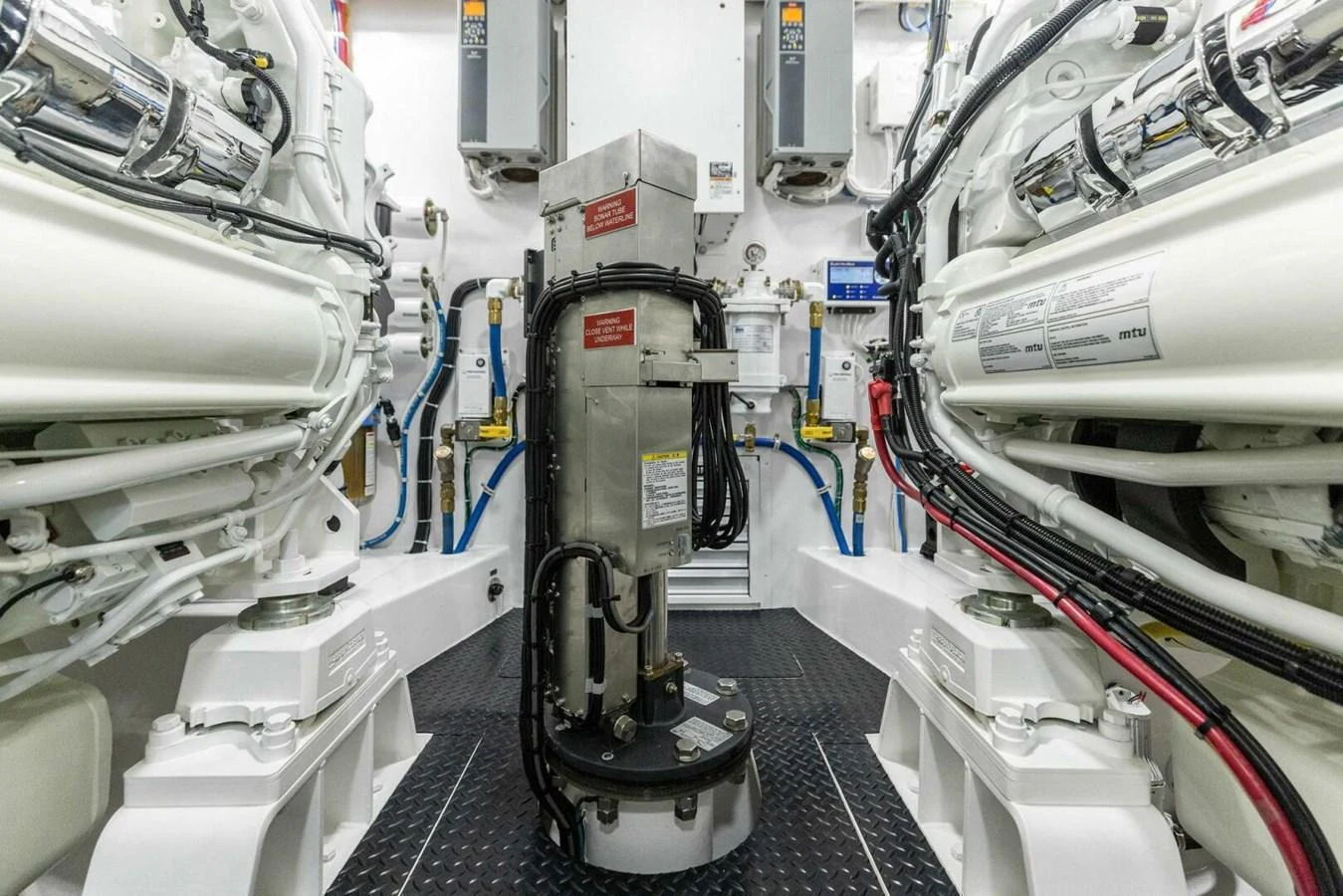 The image showcases the pristine and well-organized engine room of the yacht. aboard TEAM HARVEY I Yacht for Sale
