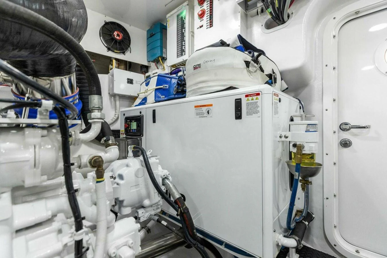 The image showcases the yacht's well-maintained engine room with various mechanical components and equipment. aboard TEAM HARVEY I Yacht for Sale