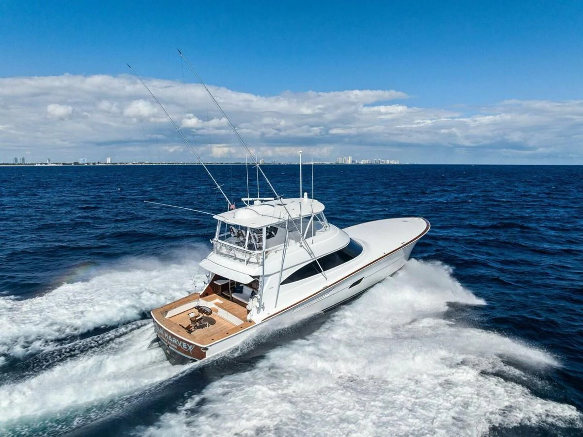 A sleek yacht cruises swiftly through the open sea, showcasing its elegant design and powerful performance. aboard TEAM HARVEY I Yacht for Sale