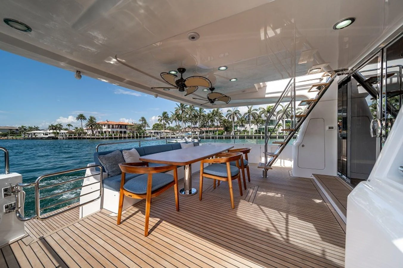 The aft deck features a spacious dining area with a beautiful view of the water. aboard NEW BOAT Yacht for Sale