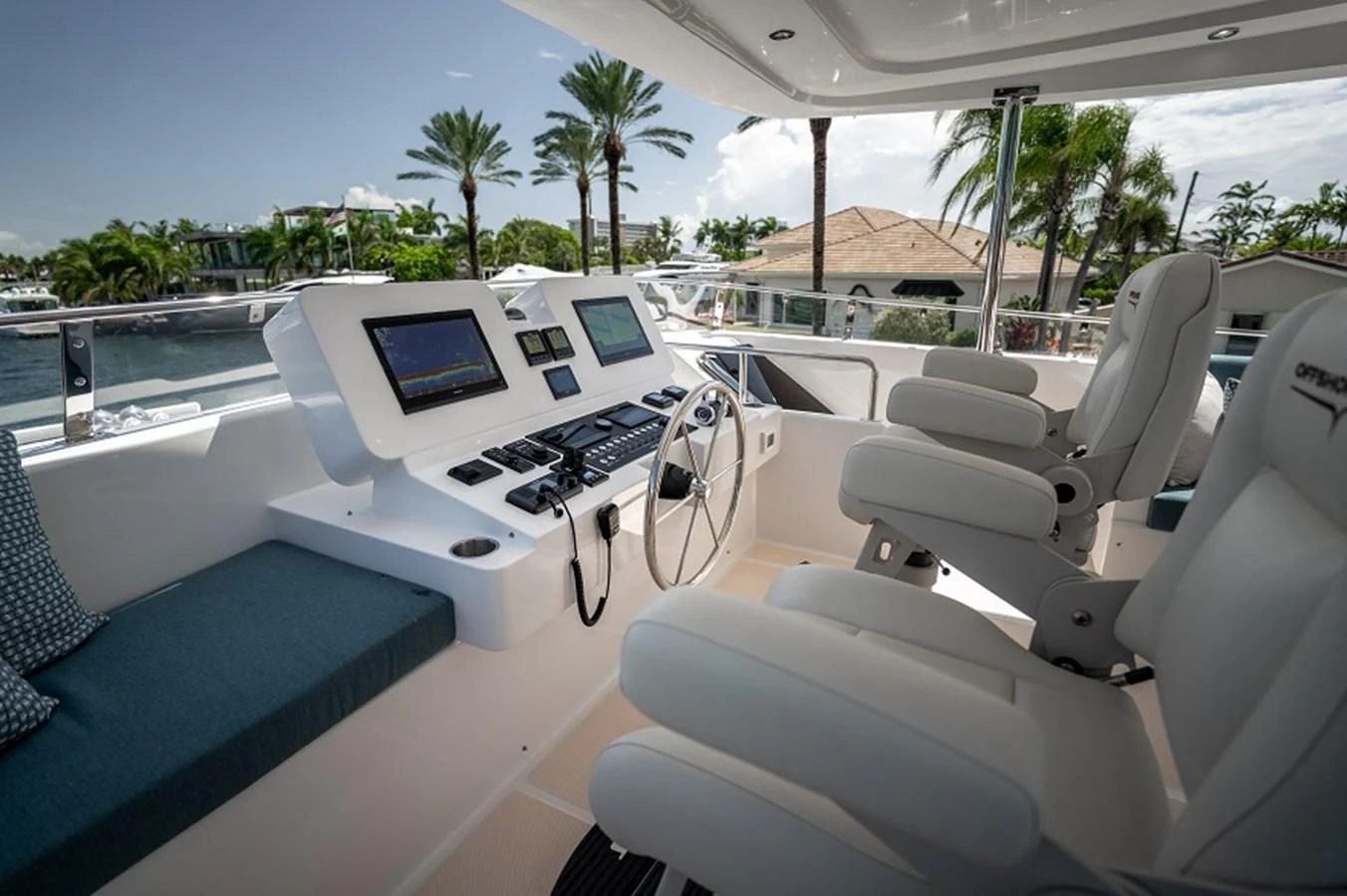 The helm station features modern navigation equipment and comfortable seating, offering a commanding view for the captain. aboard NEW BOAT Yacht for Sale