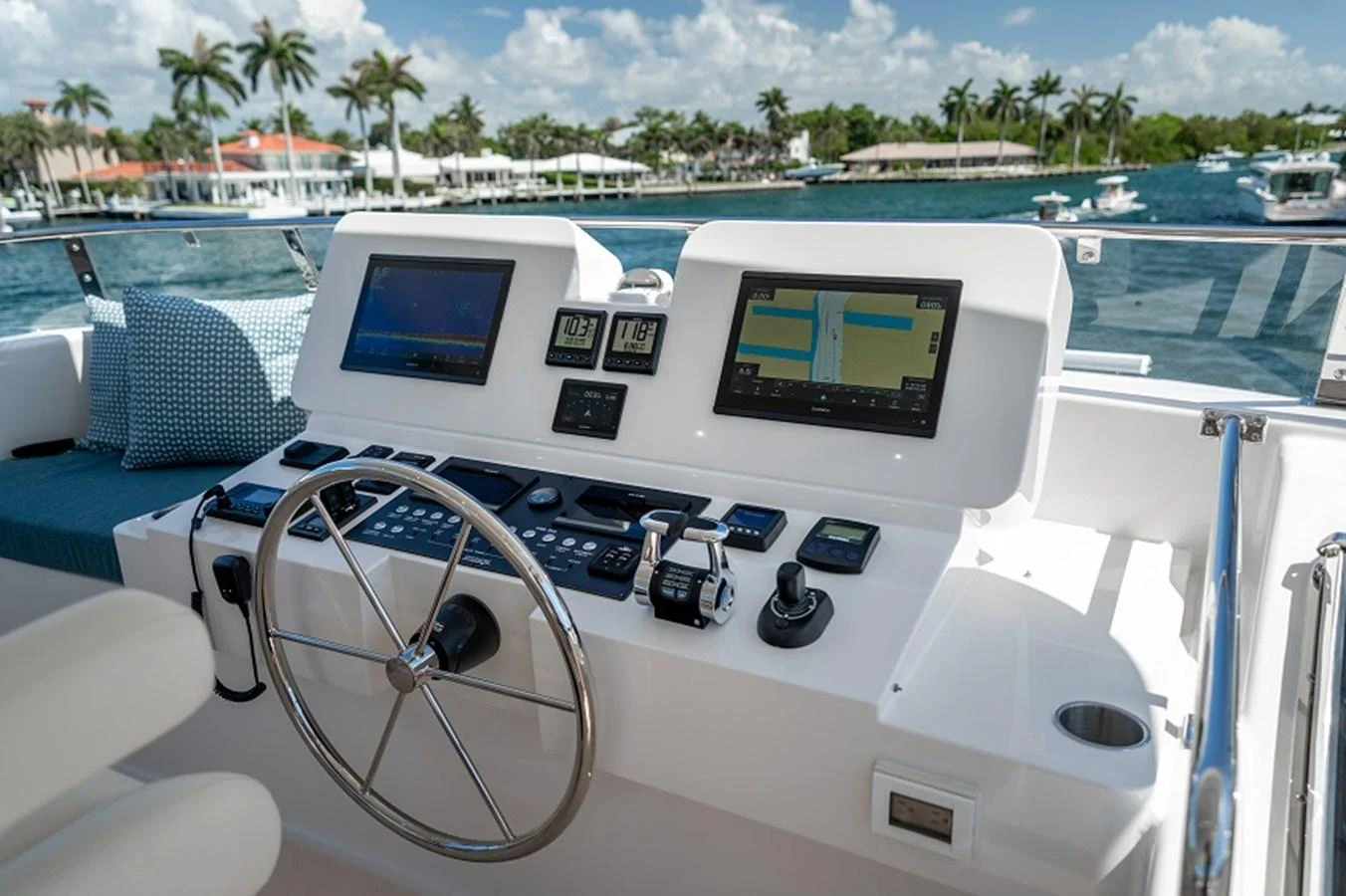 The helm station features advanced navigation equipment and a comfortable seating area with a scenic view. aboard NEW BOAT Yacht for Sale